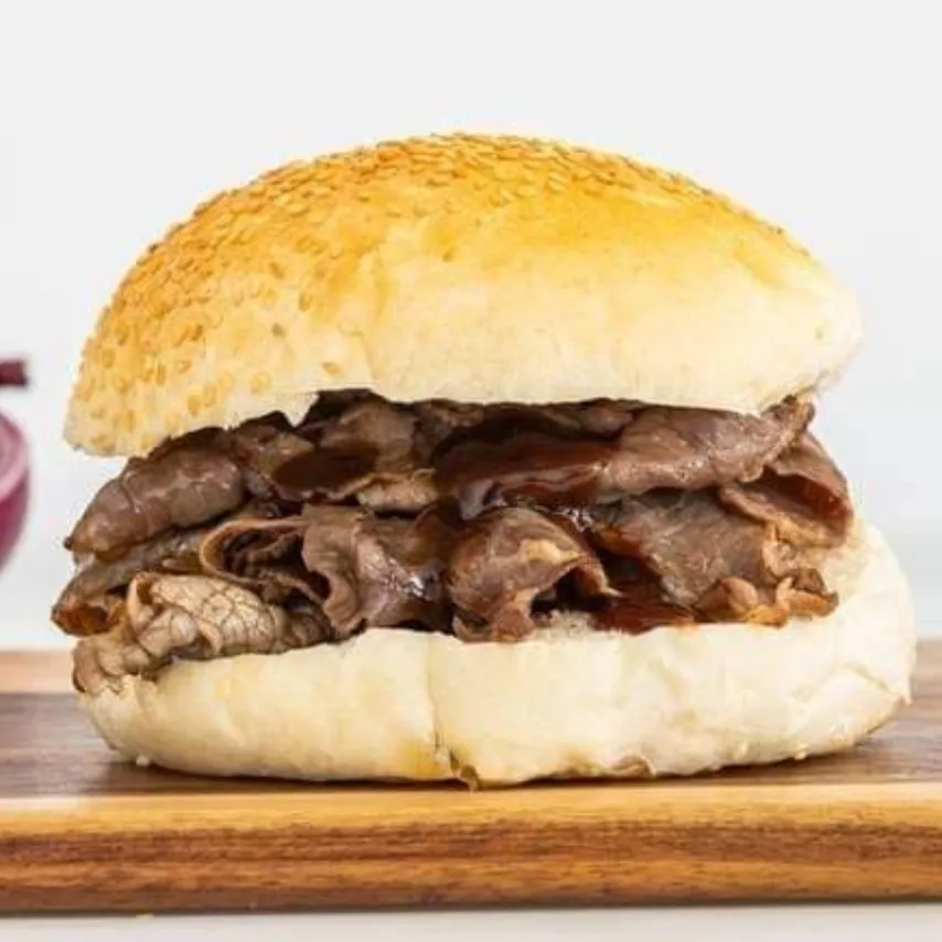 Roast beef roll on a wooden board, a Roadside Cafe lunchtime favourite